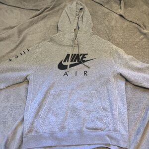 Large gray Nike hoodie with black writing